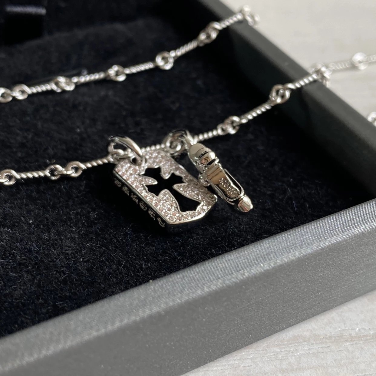 CH diamond cross necklace stacking design